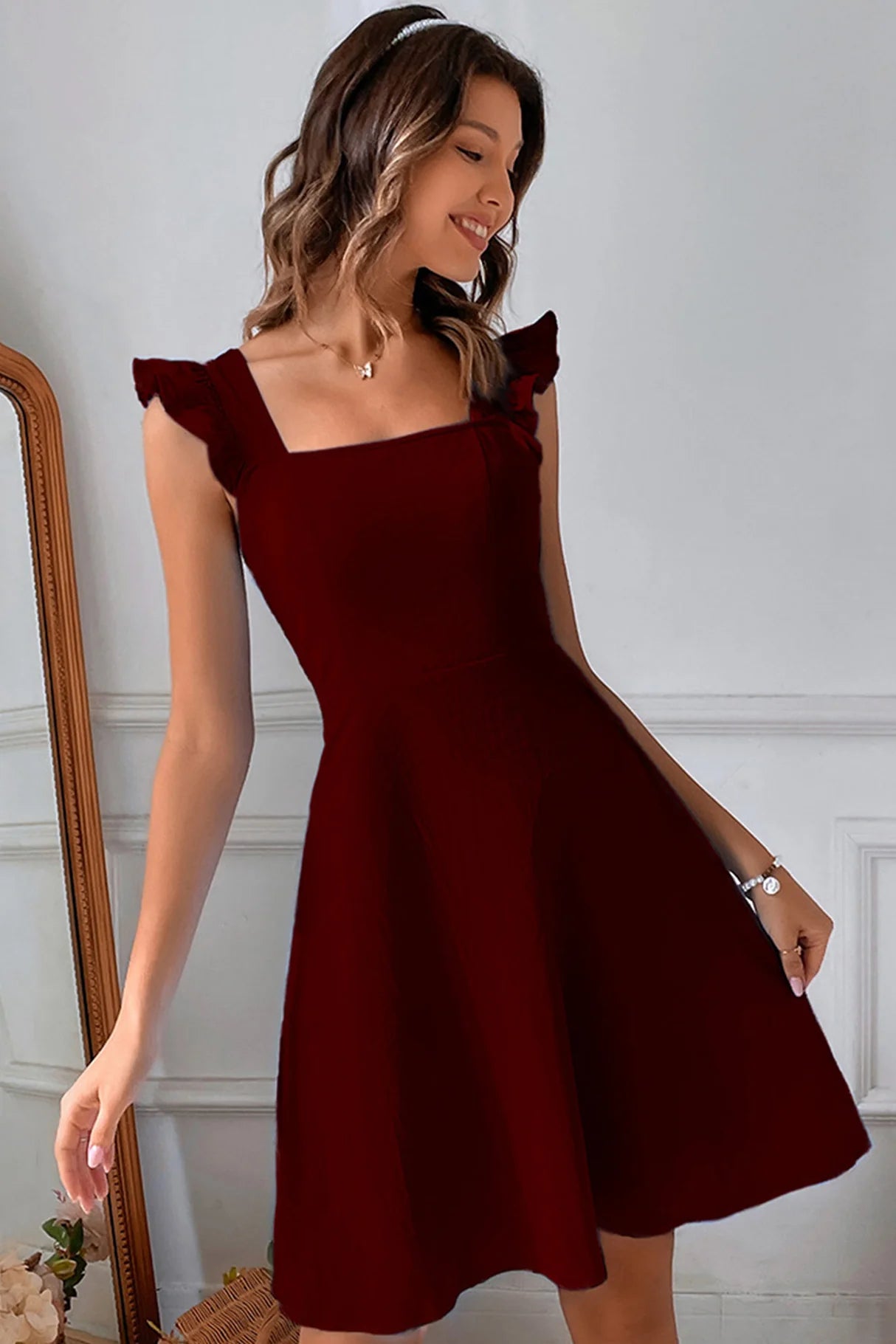 Ruffle Sleeveless Tie-back Mini Dresses