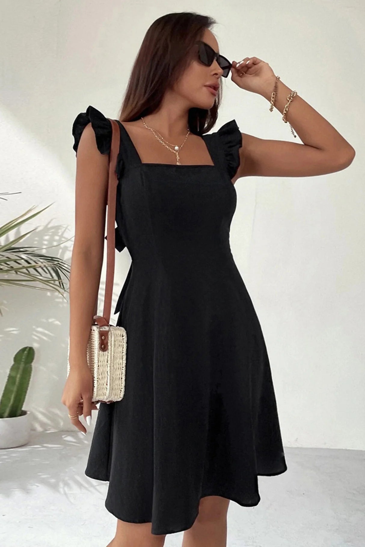 Ruffle Sleeveless Tie-back Mini Dresses