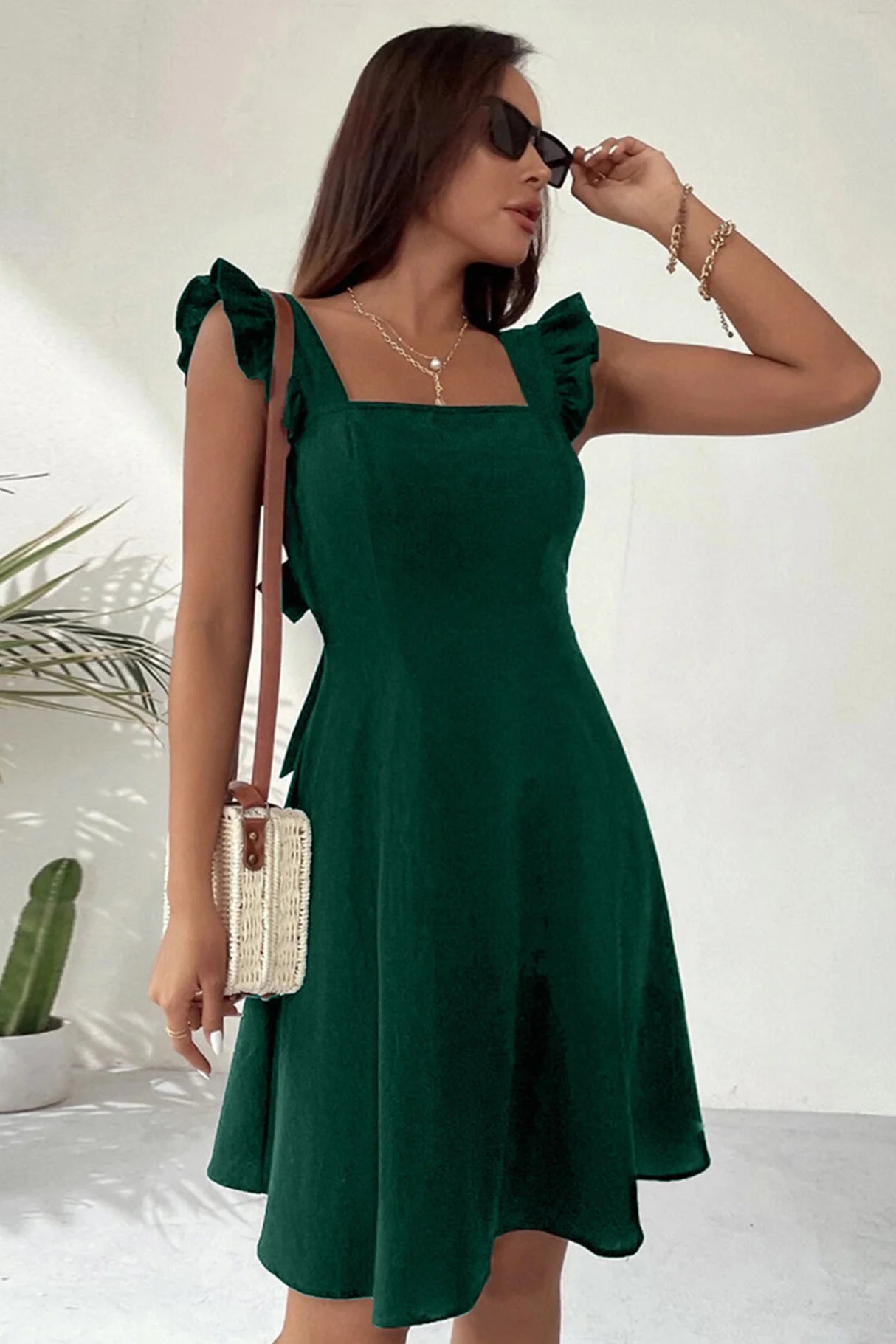 Ruffle Sleeveless Tie-back Mini Dresses