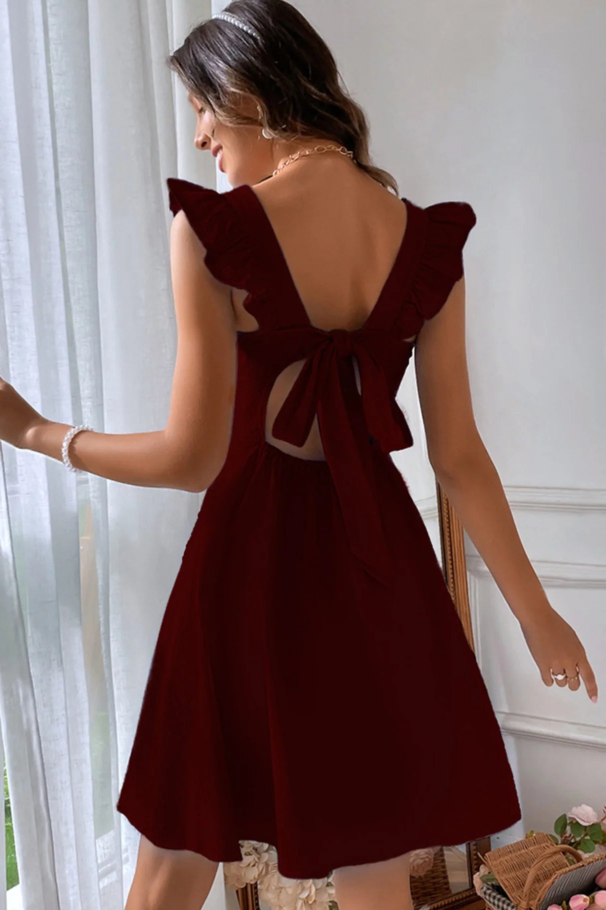 Ruffle Sleeveless Tie-back Mini Dresses